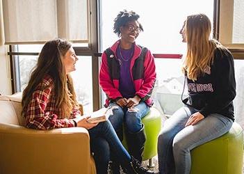 Group of 3 students talking